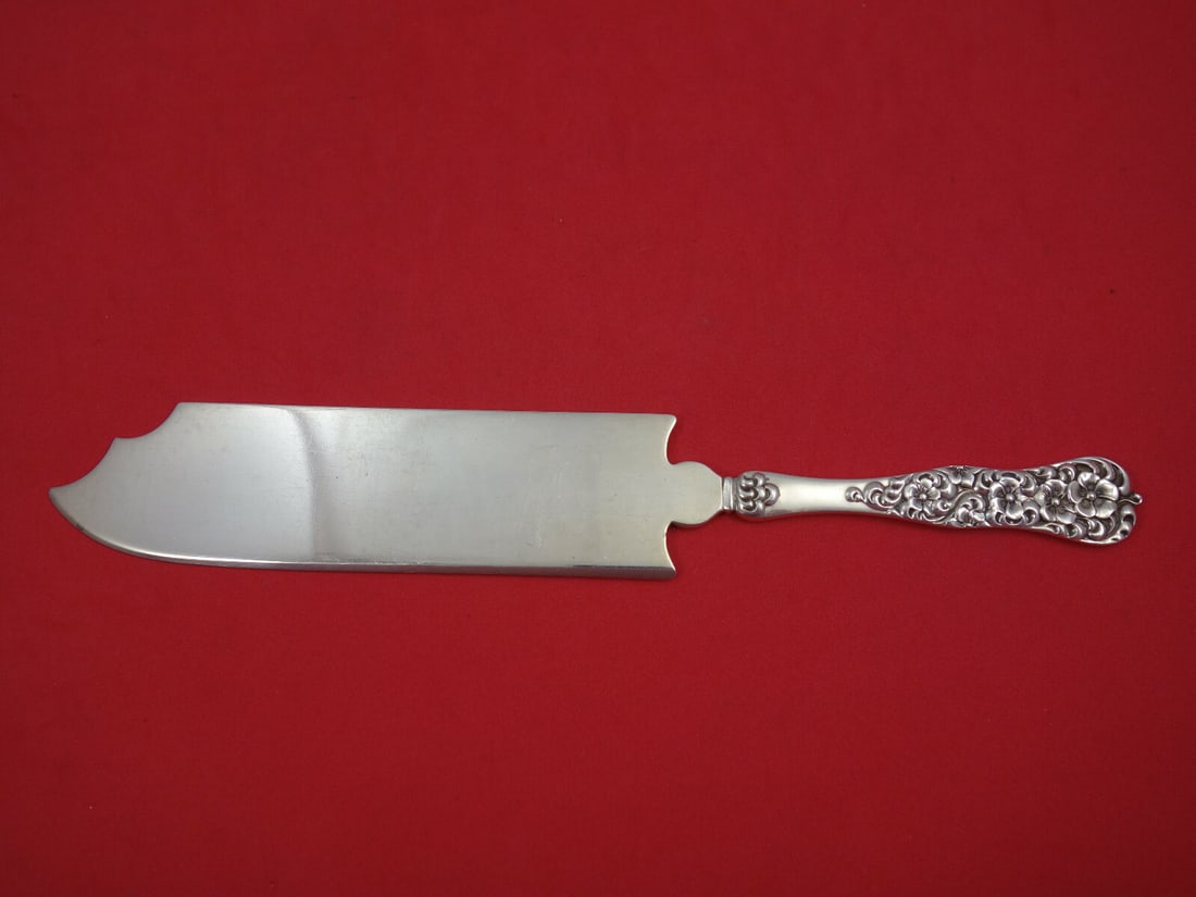 Dominick & Haff Rococo Sterling Silver Ice Cream Slice 9 3/4": Dominick & Haff Rococo Sterling Silver Ice Cream Slice 9 3/4" This exquisite ice cream slice features the elegant Rococo pattern by Dominick & Haff. Crafted from high-quality sterling silver, this pie