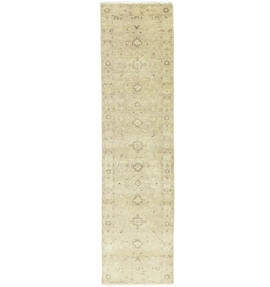 Hand Knotted Wool Floral Runner Rug 2'7 x 9'10: Hand Knotted Wool Floral Runner Rug 2'7 x 9'10 This handmade oriental runner rug features a floral design in muted tones of pinkish beige, cream, and brown. Expertly hand-knotted from wool, it offers 