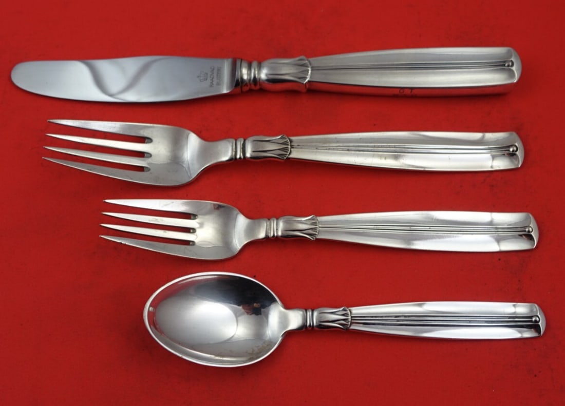 W & S Sorensen Lotus Sterling Silver 4-Piece Dinner Place Setting: W & S Sorensen Lotus Sterling Silver 4-Piece Dinner Place Setting Enhance your dining experience with the elegant Lotus pattern flatware set by W & S Sorensen. This 4-piece dinner size place setting i
