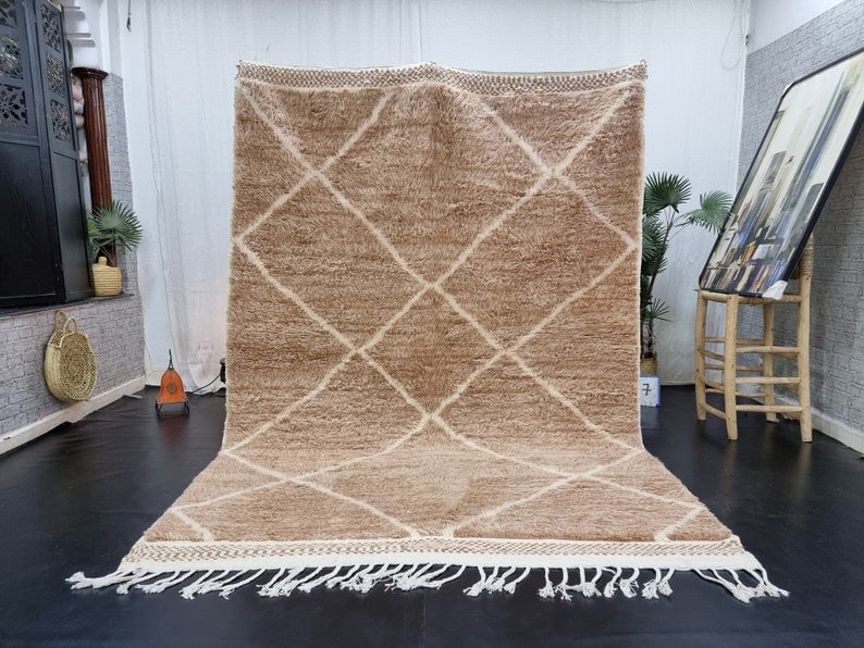 Authentic Handmade Moroccan Berber Wool Rug 8 x 5 Feet: Authentic Handmade Moroccan Berber Wool Rug 8 x 5 Feet Discover the elegance of this authentic, handmade Moroccan Berber wool rug in a soft brown hue. Adorned with a striking white geometric pattern, 