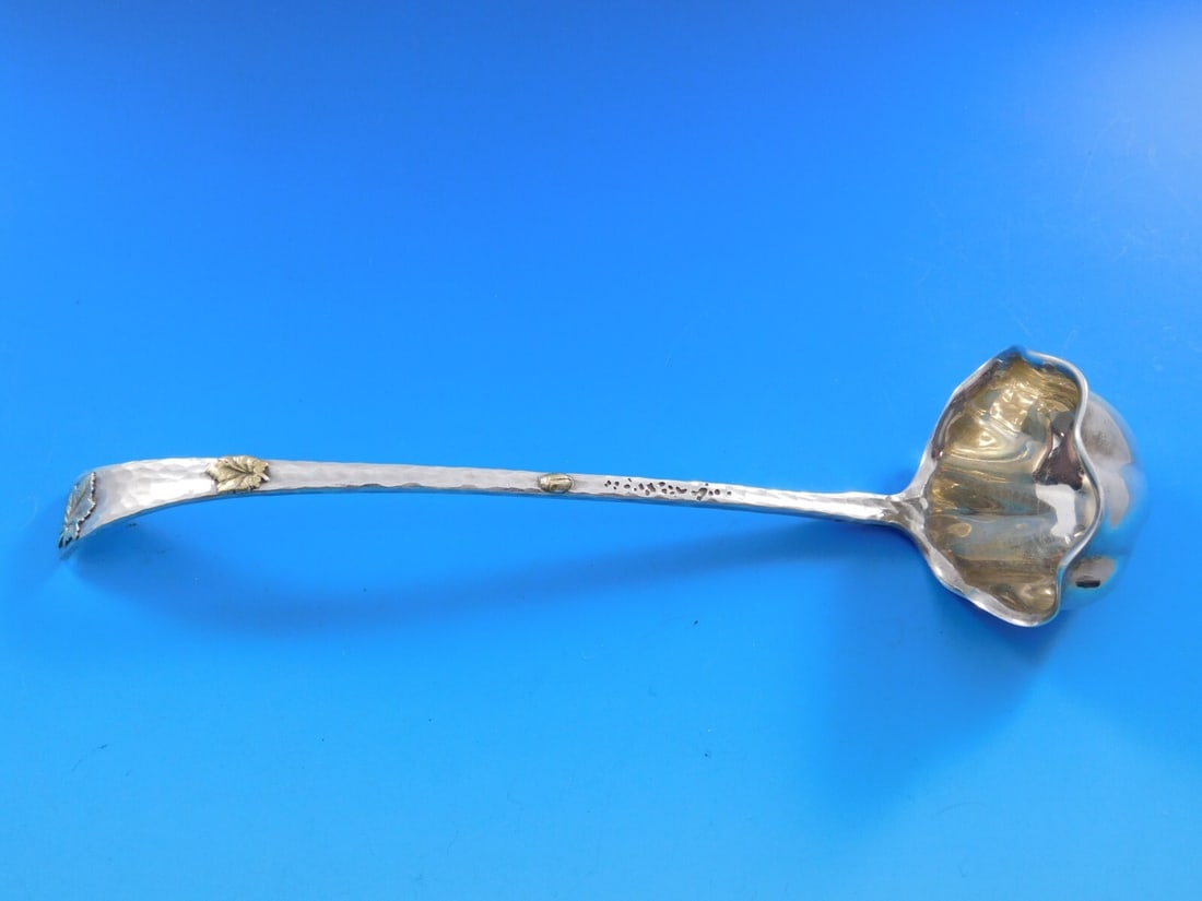 Tiffany & Co. Sterling Silver Sauce Ladle with Gold-Washed Leaves 7 1/8": Tiffany & Co. Sterling Silver Sauce Ladle with Gold-Washed Leaves 7 1/8" This exquisite ladle by Tiffany & Co. showcases a rare aesthetic design, featuring a lap over edge with beautifully applied gol