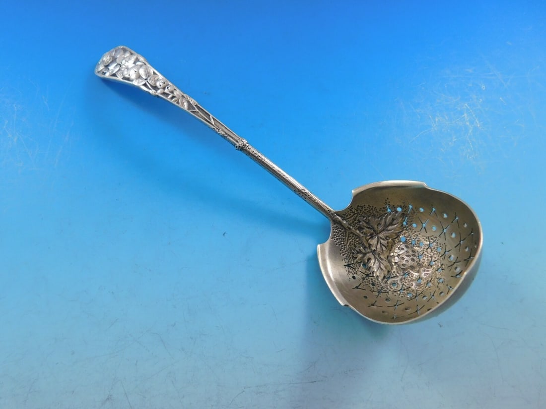 Gorham Eglantine Sterling Silver Sugar Sifter Ladle Gold-Washed Berries 6 5/8": Gorham Eglantine Sterling Silver Sugar Sifter Ladle Gold-Washed Berries 6 5/8" This exquisite Eglantine Sterling Silver Sugar Sifter Ladle by Gorham is a stunning addition for any collector or table s