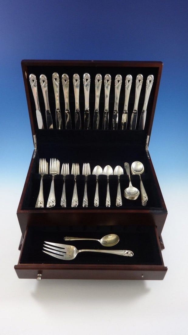 62 Piece Spring Glory Sterling Silver Flatware Set by International: 62 Piece Spring Glory Sterling Silver Flatware Set by International This is a 62-piece "Spring Glory" flatware set by International, crafted from sterling silver. The set includes 12 knives, 12 forks,