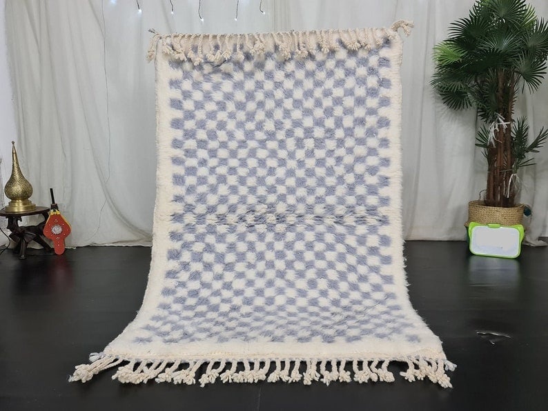 Handmade Moroccan Berber Wool Rug 8 x 5 Feet: Handmade Moroccan Berber Wool Rug 8 x 5 Feet Experience the warmth and charm of this stunning soft handmade Moroccan Berber wool rug. Expertly handwoven by local Berber women weavers in the Middle Atl
