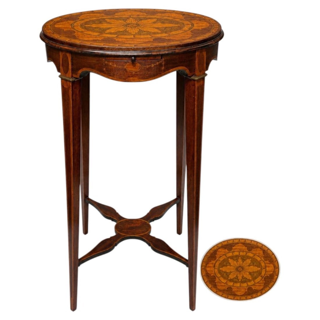 Edwardian Oval Inlaid Tea Table with Pull Slide Shelf: Edwardian Oval Inlaid Tea Table with Pull Slide Shelf This Edwardian tea table features an elegant oval top adorned with intricate marquetry and fruitwood inlay, highlighted by a central stylized flor