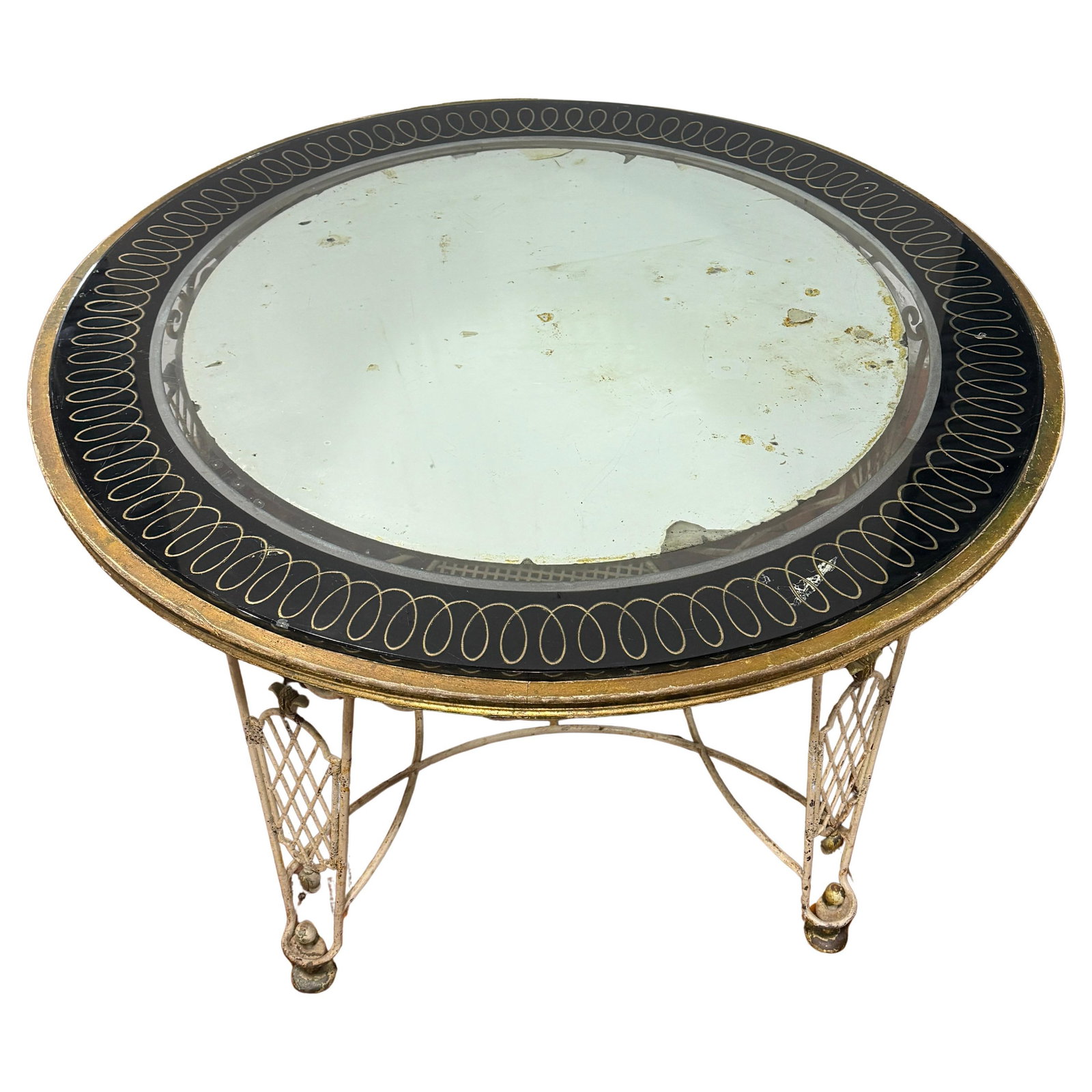 French Mid-Century Neoclassical Wrought Iron and Eglomise Mirror Table: French Mid-Century Neoclassical Wrought Iron and Eglomise Mirror Table This French mid-century circular table, attributed to Rene Drouet, features a painted wrought iron frame with gilt highlights in 