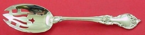Lunt Alexandra Sterling Silver Slotted Serving Spoon 8 1/4": Lunt Alexandra Sterling Silver Slotted Serving Spoon 8 1/4" This stunning slotted serving spoon is crafted from high-quality sterling silver, featuring the elegant Alexandra pattern by Lunt. Measuring