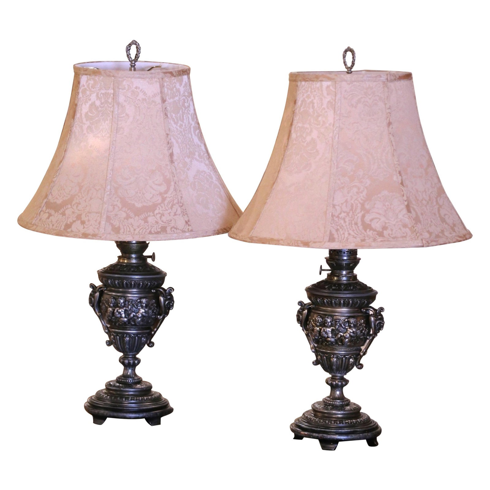 Set of 2 19th Century French Neoclassical Repousse Oil Lamps: Set of 2 19th Century French Neoclassical Repousse Oil Lamps Illuminate your space with this exquisite pair of 19th Century French polished repousse urn-shaped table oil lamps. Crafted circa 1880 in F
