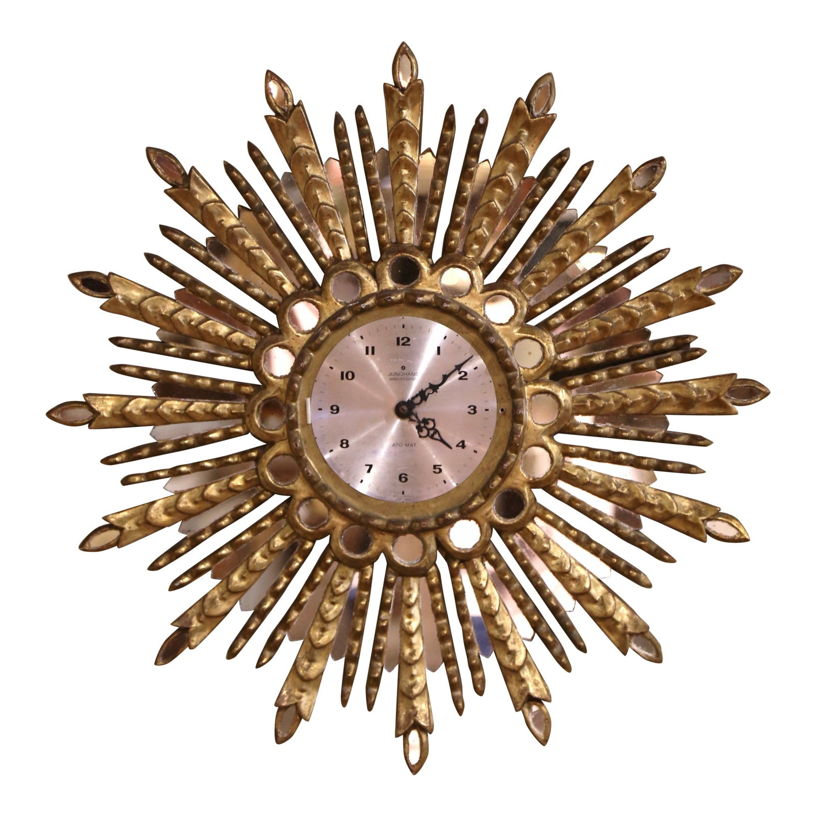 Spanish Giltwood Sunburst Wall Clock with Mirror Accents circa 1970: Spanish Giltwood Sunburst Wall Clock with Mirror Accents circa 1970 This mid-century Spanish wall clock features a hand-carved giltwood sunburst design with mirrored insets, crafted circa 1970. The pi