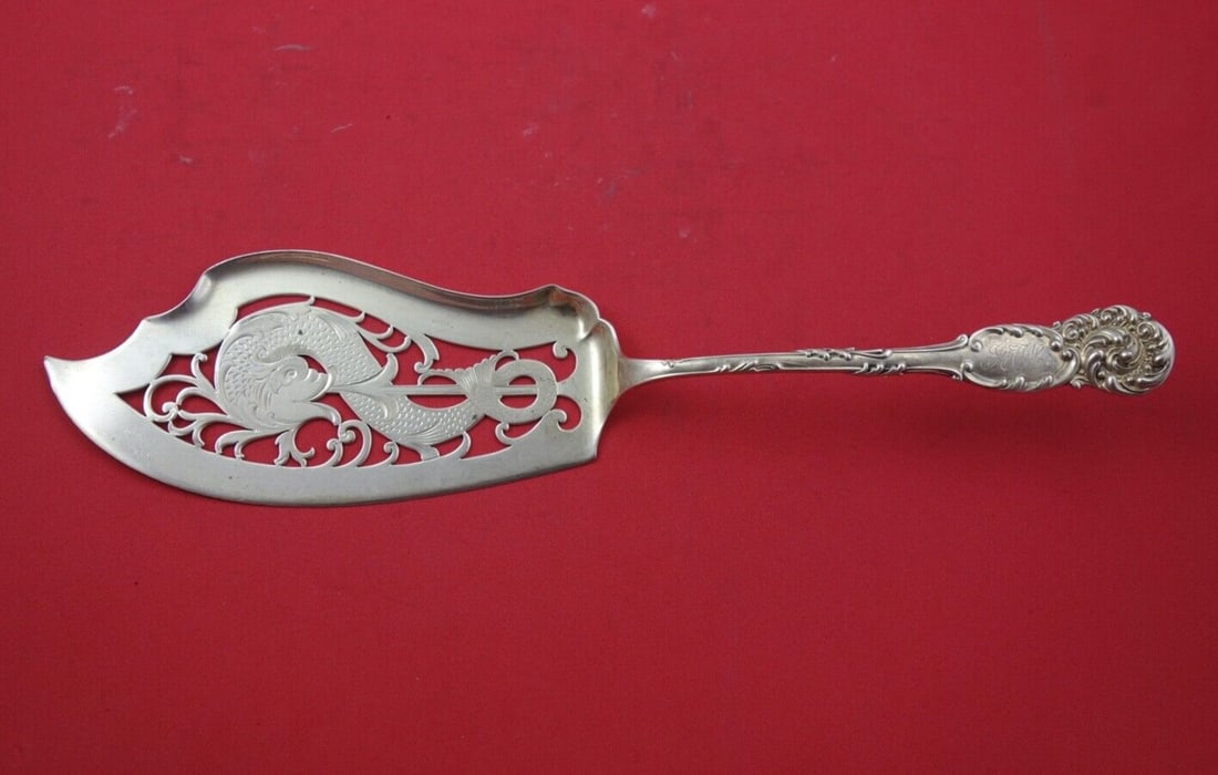 Reed and Barton La Reine Sterling Silver Fish Server 11 3/4 Inch Pierced Design: Reed and Barton La Reine Sterling Silver Fish Server 11 3/4 Inch Pierced Design Enhance your dining experience with this exquisite fish server from the La Reine pattern by Reed and Barton. Crafted fro