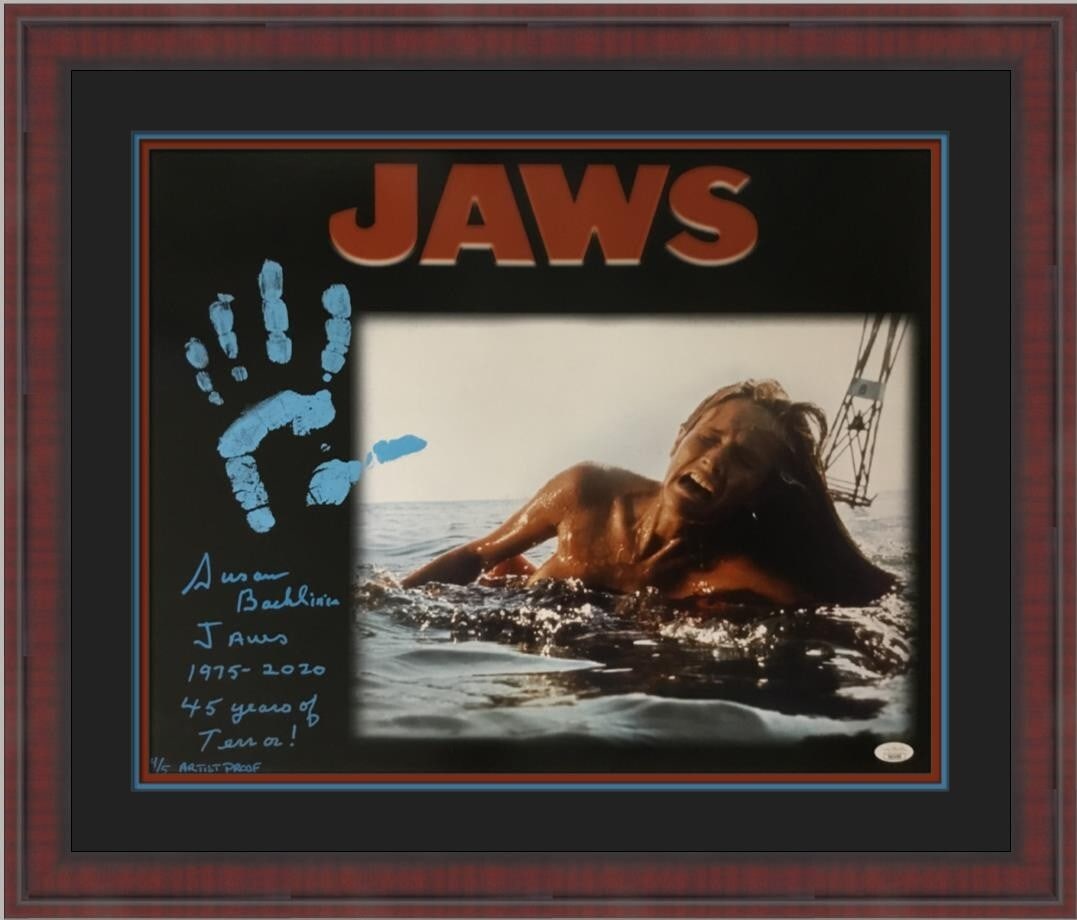 Custom framed Jaws photo signed by Susan Backlinie JSA AP 4 of 5: Custom framed Jaws photo signed by Susan Backlinie JSA AP 4 of 5 This is an original autographed photograph of Susan Backlinie from the movie Jaws, custom framed for display. The photograph is signed 