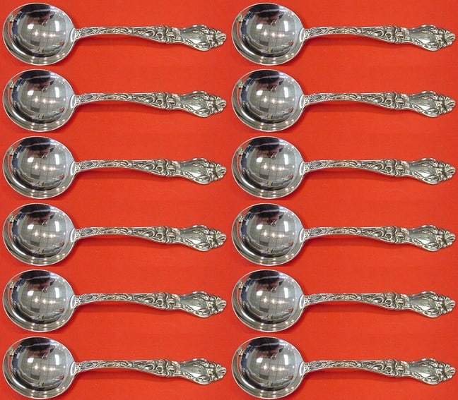 Frank Whiting Lily Sterling Silver Cream Soup Spoon Set of 12: Frank Whiting Lily Sterling Silver Cream Soup Spoon Set of 12 Enhance your dining experience with this exquisite set of 12 cream soup spoons in the elegant "Lily" pattern by Frank Whiting. Crafted fro
