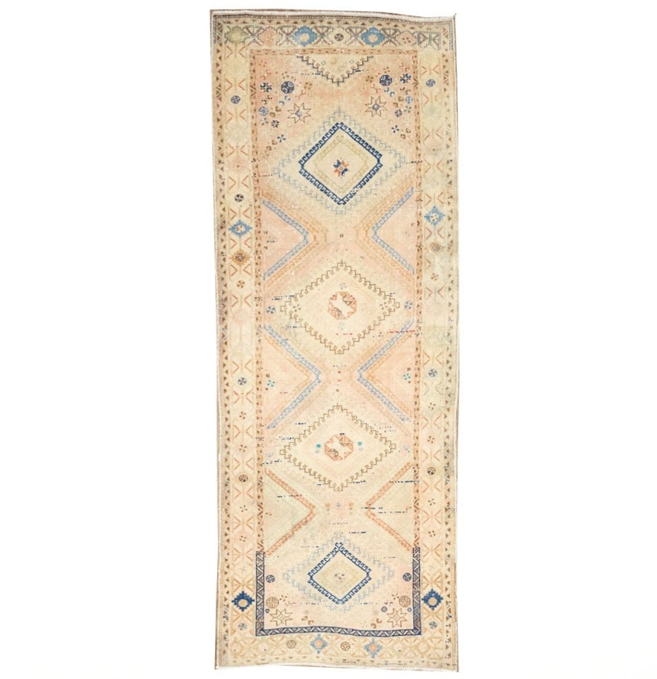 Hand-Knotted Wool Geometric Runner Rug 3'5 x 9'7 Tribal Vintage: Hand-Knotted Wool Geometric Runner Rug 3'5 x 9'7 Tribal Vintage This semi-antique handmade runner rug features a geometric tribal pattern in muted tones of light salmon, beige, brown, and blue. Crafte