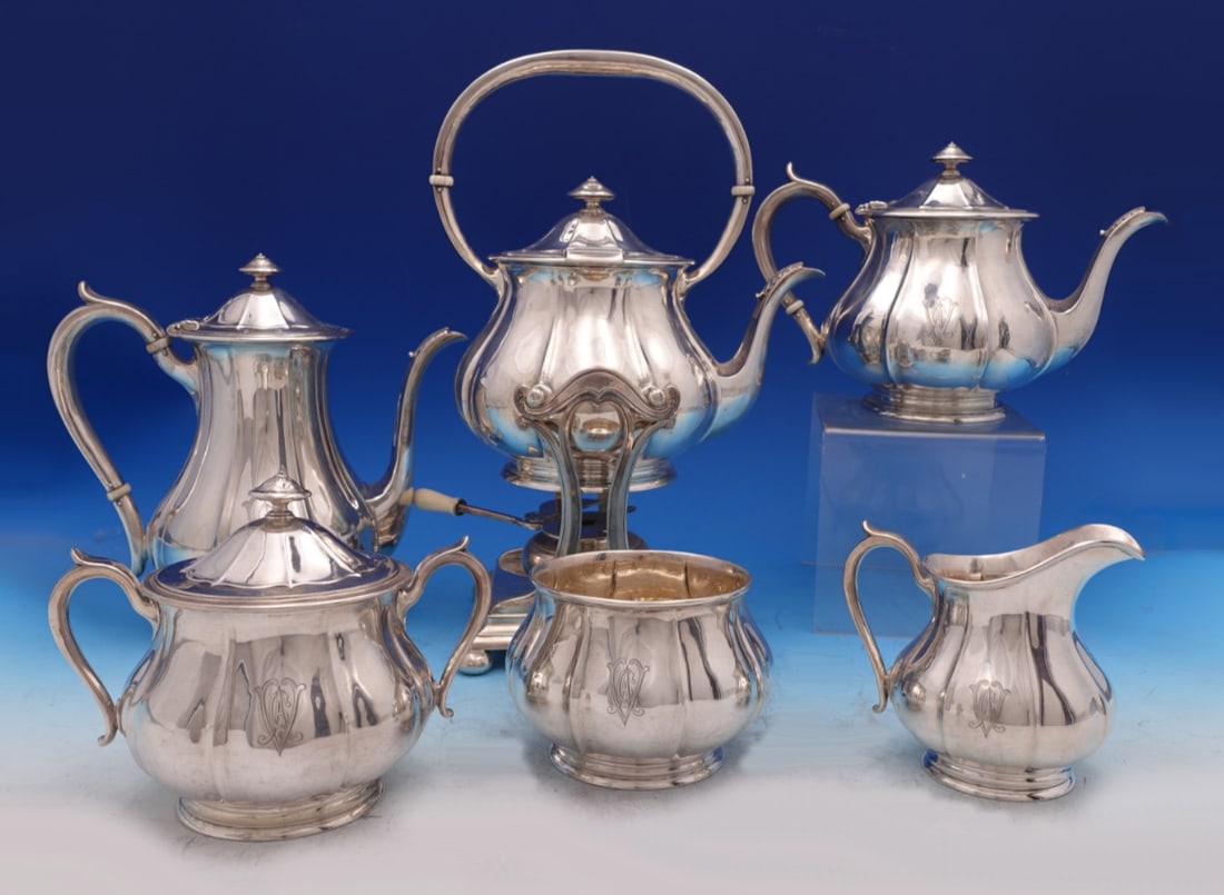 Six-Piece Sterling Silver Tea and Coffee Service by Arthur Stone with Tilting Kettle: Six-Piece Sterling Silver Tea and Coffee Service by Arthur Stone with Tilting Kettle This exquisite six-piece tea set by Arthur Stone is crafted from sterling silver and dates from 1900-1940. The set 