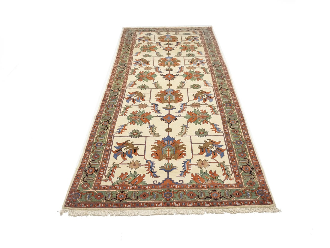 Oversized 6'7 x 16'7 Wool Area Rug with Geometric Floral Pattern Handmade: Oversized 6'7 x 16'7 Wool Area Rug with Geometric Floral Pattern Handmade This handmade oversized area rug features a geometric floral pattern in muted cream, green, blue, orange, and black tones. Exp