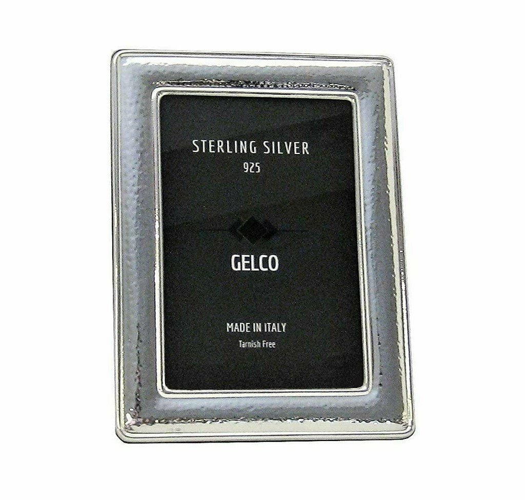 Handcrafted Italian 925 Sterling Silver Glossy Hammered Photo Frame: Handcrafted Italian 925 Sterling Silver Glossy Hammered Photo Frame This is a handmade picture frame crafted from 925 sterling silver with a glossy hammered finish. Made in Italy, it is designed to di