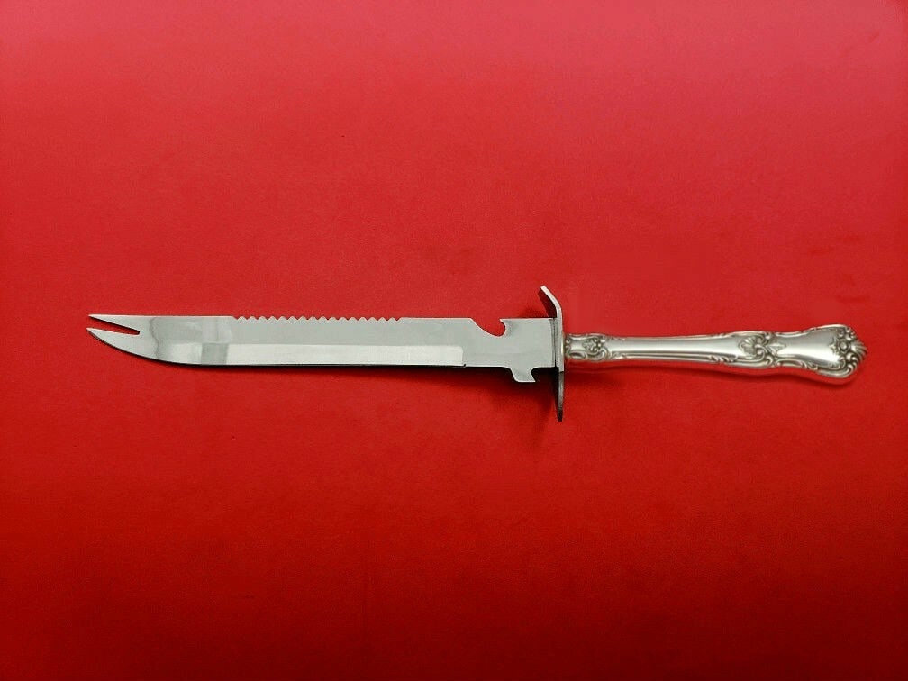 Lunt Memory Lane Sterling Silver Ham Slice Knife 11 1/2": Lunt Memory Lane Sterling Silver Ham Slice Knife 11 1/2" This exquisite ham slice knife from the Memory Lane pattern by Lunt is crafted from sterling silver with a hollow handle and features a stainle