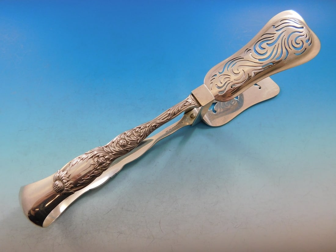 Tiffany & Co. Sterling Silver Asparagus Tongs Chrysanthemum Pattern English Style: Tiffany & Co. Sterling Silver Asparagus Tongs Chrysanthemum Pattern English Style These sterling silver asparagus tongs are crafted in the Chrysanthemum pattern by Tiffany & Co. Featuring an English s