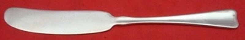 Tiffany & Co Lap Over Edge Sterling Silver Butter Spreader Knife: Tiffany & Co Lap Over Edge Sterling Silver Butter Spreader Knife Discover the elegance of the Lap Over Edge Butter Spreader from Tiffany & Co. This exquisite piece of flatware features a sleek sterlin