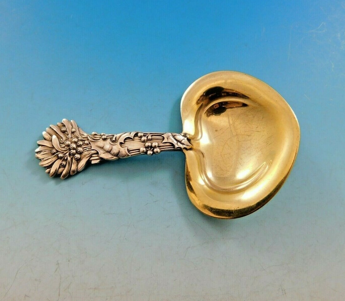 Tiffany & Co Holly Sterling Silver Nut Spoon Heart Bowl 3 3/4": Tiffany & Co Holly Sterling Silver Nut Spoon Heart Bowl 3 3/4" Discover the exquisite Holly nut spoon by Tiffany & Co., a stunning piece crafted in sterling silver. Measuring 3 3/4" in length, this se