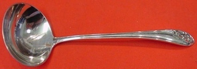 Gorham Sterling Silver 5 1/4" Lily of the Valley Sauce Ladle: Gorham Sterling Silver 5 1/4" Lily of the Valley Sauce Ladle This exquisite sauce ladle features the elegant "Lily of the Valley" pattern crafted by Gorham. Made from high-quality sterling silver, thi