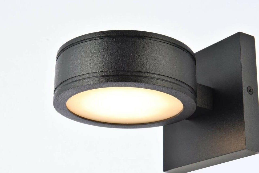 Living District Raine black outdoor LED wall sconce: Living District Raine black outdoor LED wall sconce This modern outdoor wall sconce features an integrated 8W LED bulb, providing 230 lumens of warm white light at a color temperature of 3000K. Design