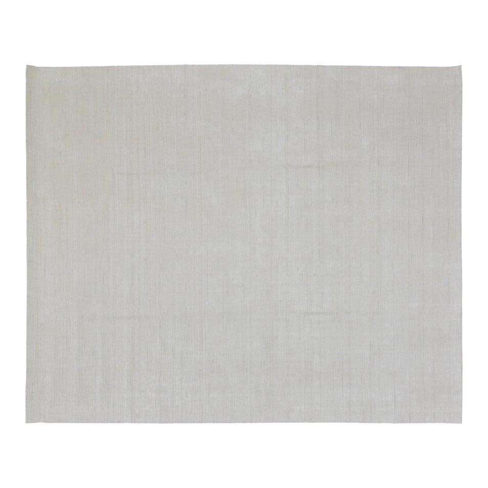 10x14 Hand Loomed Wool and Bamboo Area Rug in Modern Indian Style: 10x14 Hand Loomed Wool and Bamboo Area Rug in Modern Indian Style This contemporary Indian rug features a modern design, skillfully hand-loomed using a blend of wool and bamboo fibers. The rug comes i