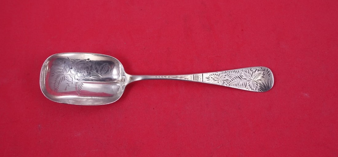 Sterling Silver Brite Cut Sugar Spoon 6 3 8 Inch Square Bowl: Sterling Silver Brite Cut Sugar Spoon 6 3 8 Inch Square Bowl This sterling silver sugar spoon features a brite-cut pattern with a decorative leaf on the handle and floral designs in the squared bowl. 