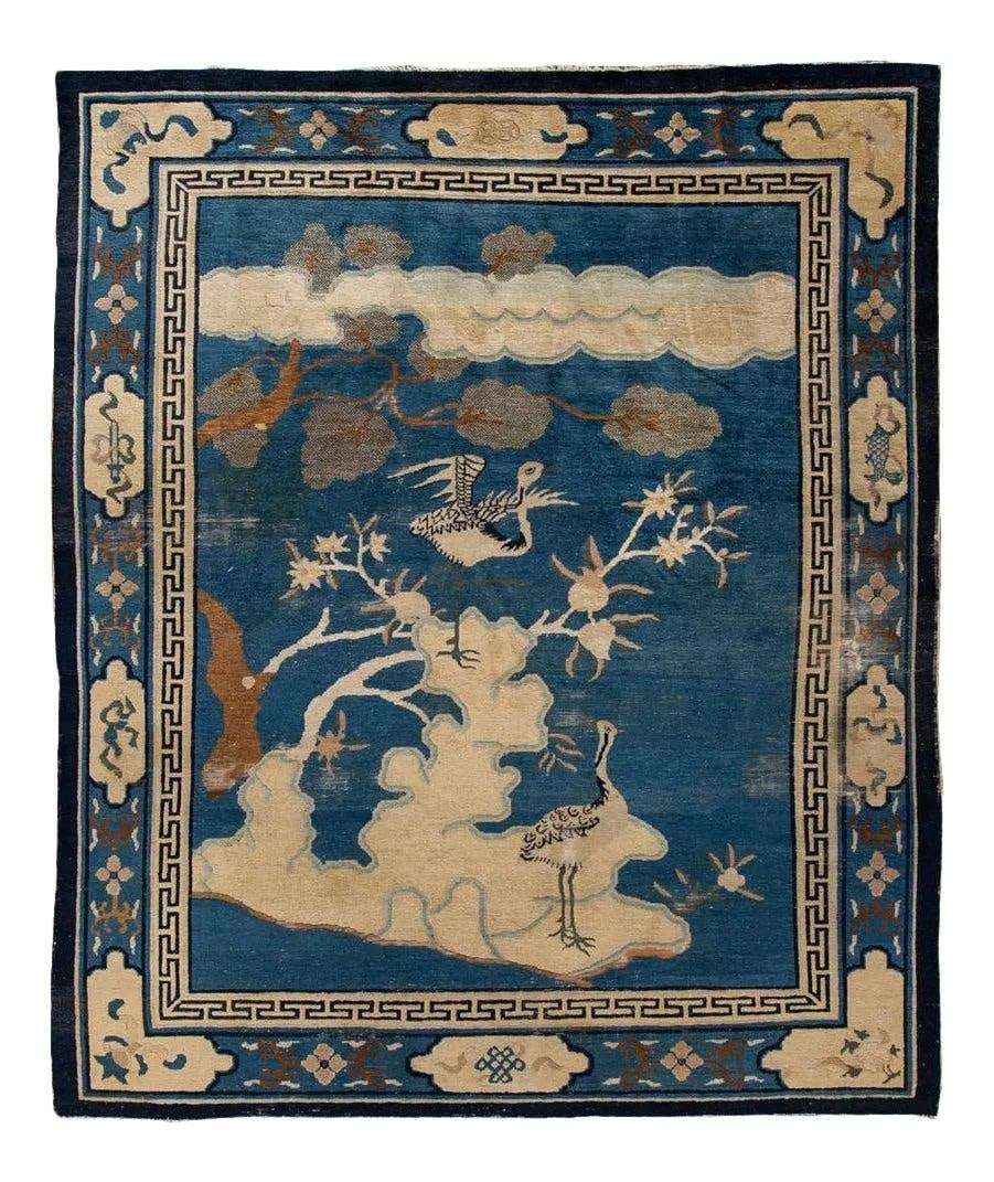 Blue Wool Chinese Peking Rug with Cranes 7'8 x 9'5: Blue Wool Chinese Peking Rug with Cranes 7'8 x 9'5 This antique Chinese Peking Art Deco rug from the 1920s showcases a vibrant indigo blue field with classic pictorial motifs such as elegant cranes, b
