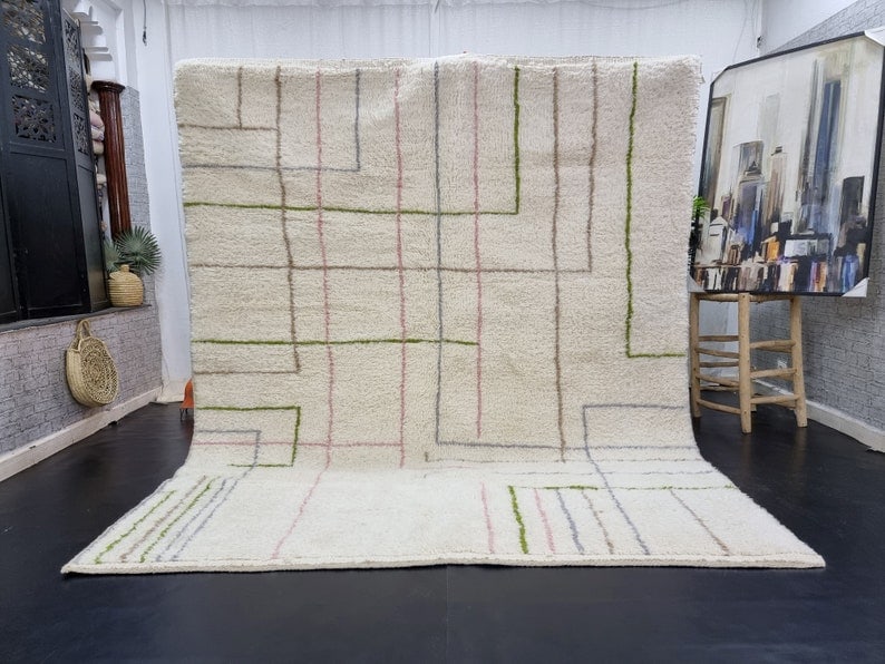 Handmade Moroccan Berber Wool Area Rug Soft White 9.84x6.56ft: Handmade Moroccan Berber Wool Area Rug Soft White 9.84x6.56ft Experience the elegance of this stunning Soft White Handmade Moroccan Berber Wool Area Rug. Expertly handwoven in the Atlas Mountains by s