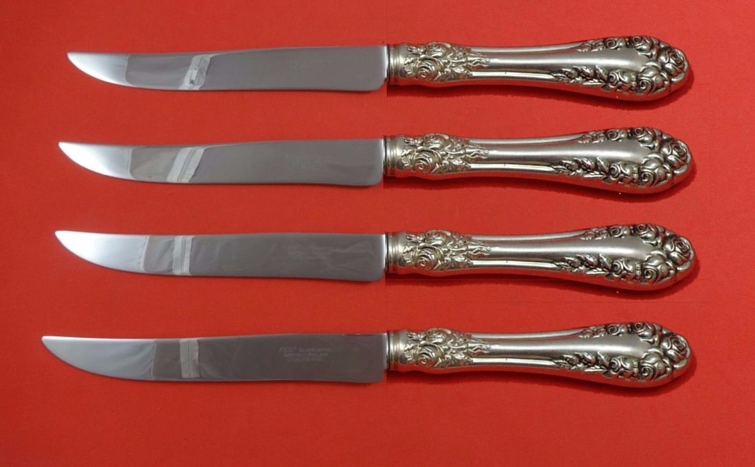 Wallace Rose Sterling Silver Steak Knife Set 4pc Texas Sized: Wallace Rose Sterling Silver Steak Knife Set 4pc Texas Sized Elevate your dining experience with this stunning 4-piece steak knife set from Wallace, featuring the elegant Rose pattern. Crafted from st
