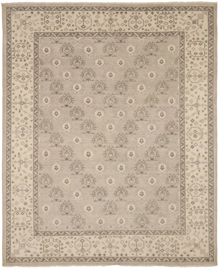 Hand-Knotted Wool Transitional Floral Area Rug 9'9 x 7'11 India: Hand-Knotted Wool Transitional Floral Area Rug 9'9 x 7'11 India This handmade transitional Oriental rug features an antique-washed floral pattern in muted tones, including beige, cream, and pastel bro