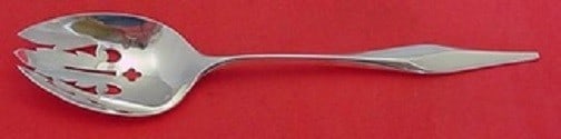 Wallace Soliloquy Sterling Silver Slotted Spoon 9 inches: Wallace Soliloquy Sterling Silver Slotted Spoon 9 inches This exquisite serving spoon, part of the Soliloquy pattern by Wallace, showcases the elegance of sterling silver craftsmanship. Measuring 9 in