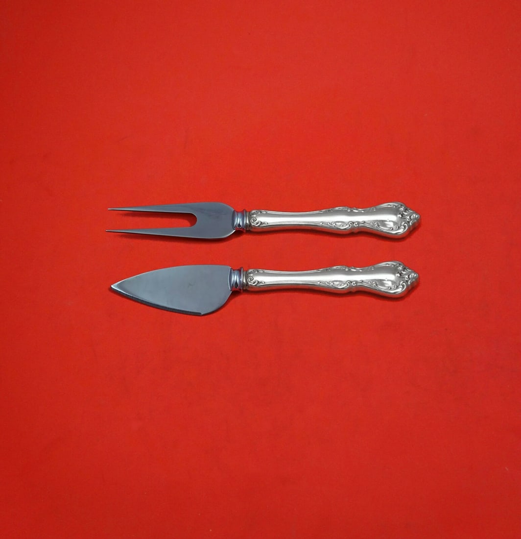 Towle Debussy Sterling Silver 2-Piece Cheese Serving Set: Towle Debussy Sterling Silver 2-Piece Cheese Serving Set Elevate your hosting experience with this exquisite 2-piece hard cheese serving set from the Debussy pattern by Towle. Crafted from high-qualit