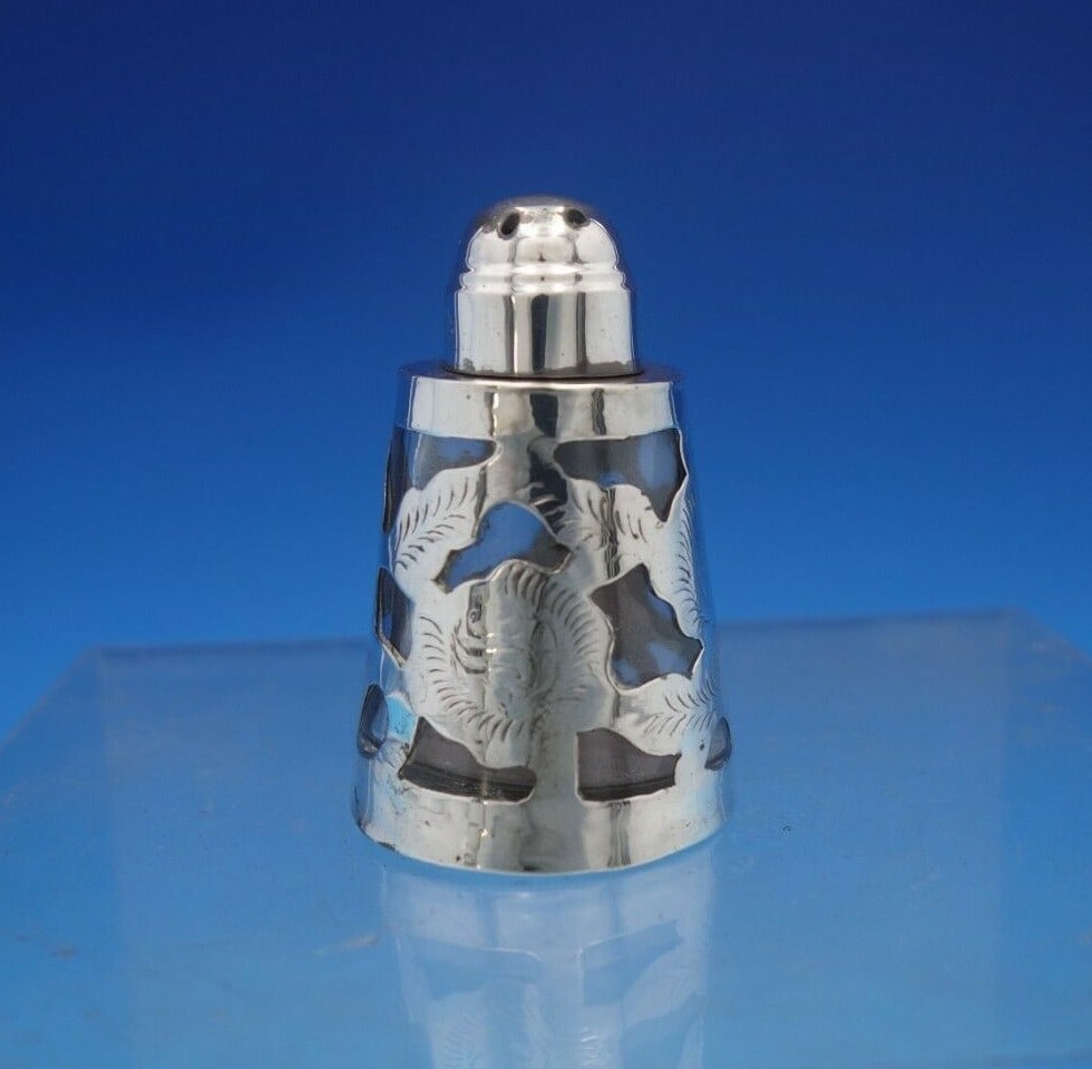 Mexican Glass Salt Shaker with Sterling Silver Overlay 2 1/4": Mexican Glass Salt Shaker with Sterling Silver Overlay 2 1/4" This exquisite Mexican glass salt shaker features a stunning sterling silver overlay. Measuring 2 1/4" in height, it showcases the craftsm