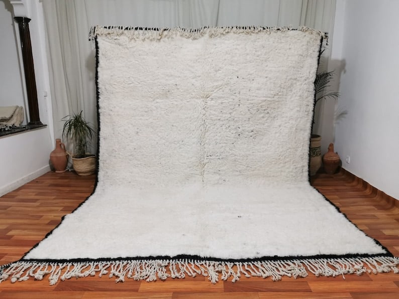 Handwoven White Soft Rug 100% Sheep Wool from Morocco: Handwoven White Soft Rug 100% Sheep Wool from Morocco This White Authentic Soft Rug is a beautifully handwoven piece created by skilled Berber women weavers in the Atlas Mountains of Morocco. Crafted 