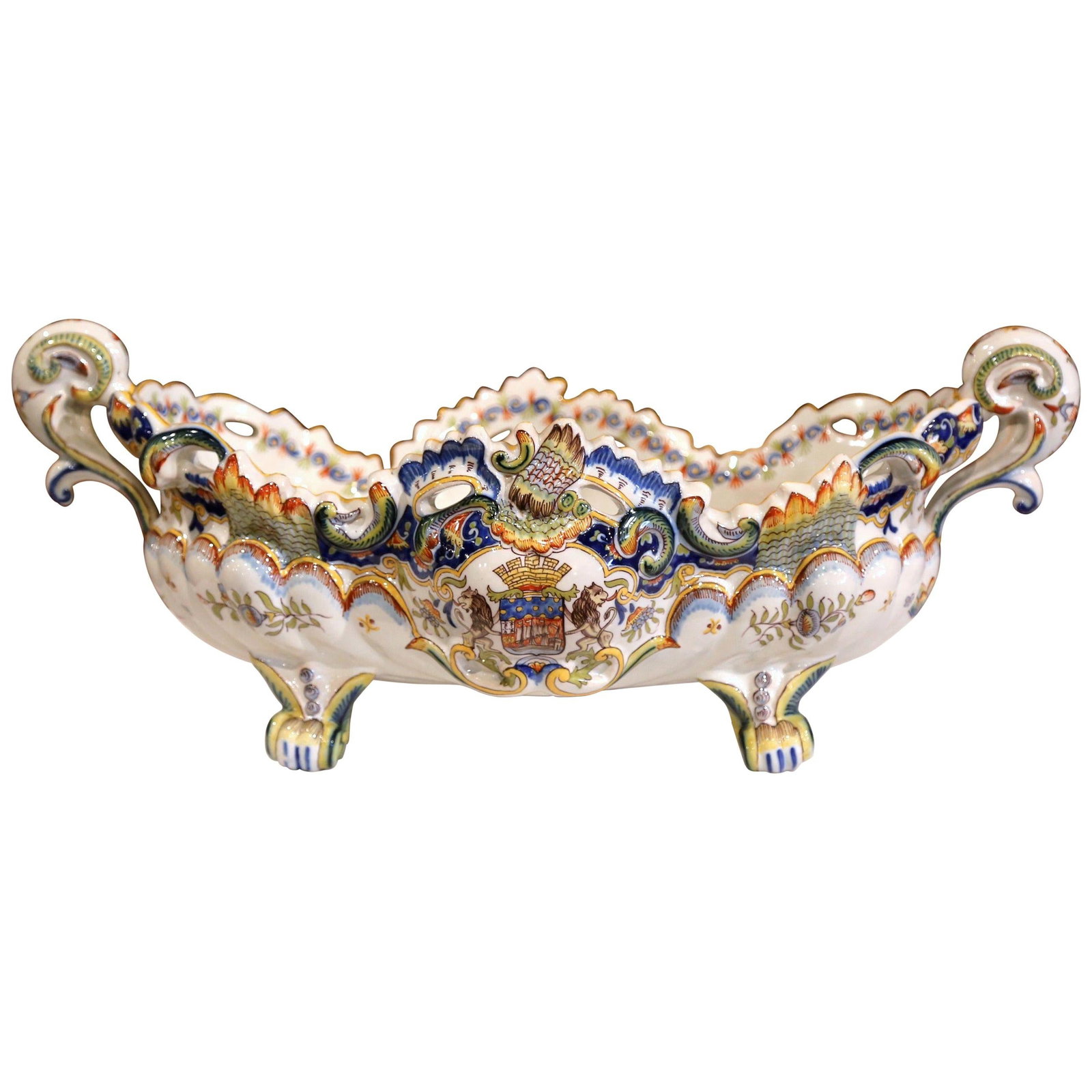 French Louis XV Faience Jardiniere with Paris Coat of Arms: French Louis XV Faience Jardiniere with Paris Coat of Arms This early 20th century French Louis XV style faience jardiniere features an oblong, gently bowed form with four scrolled feet and ornate sid