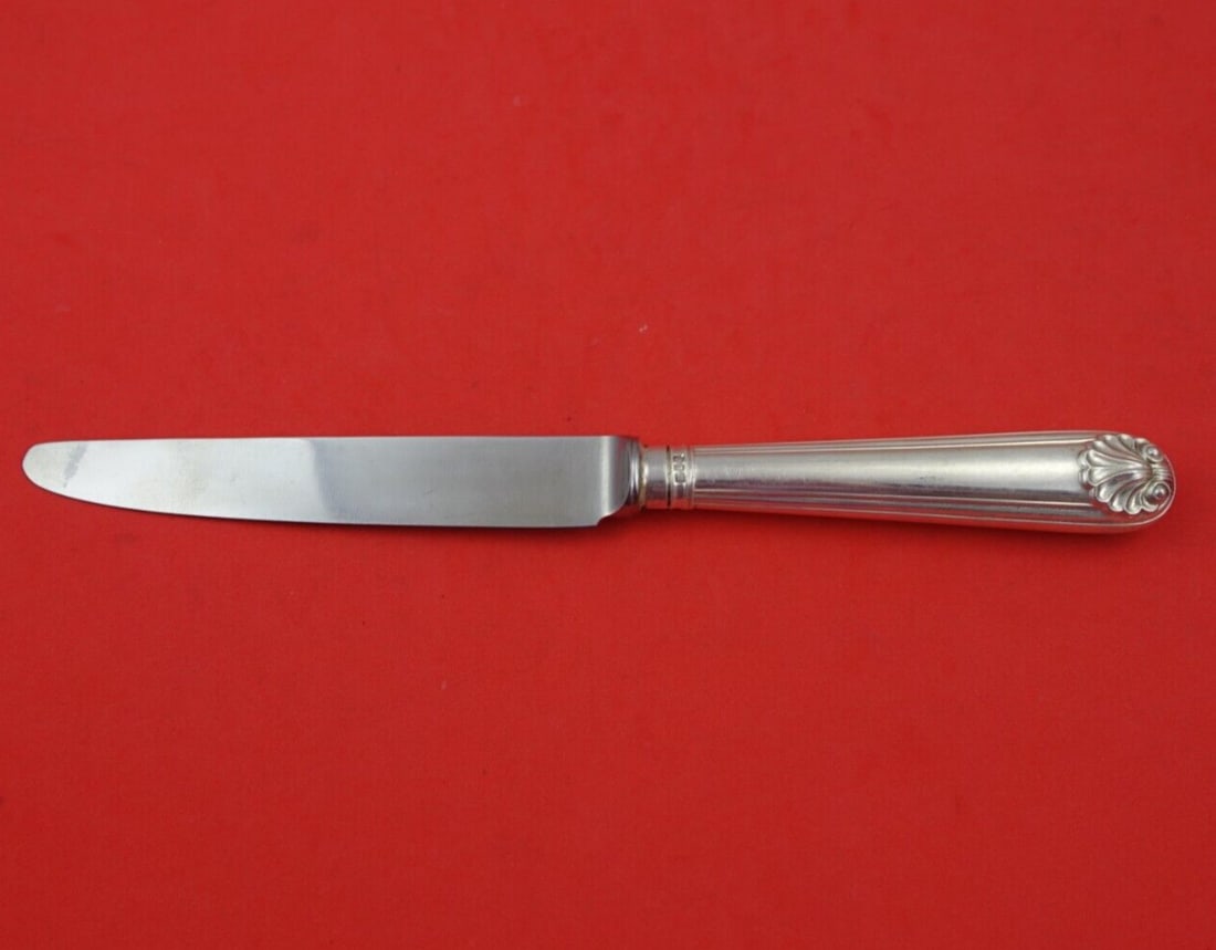 CJ Vander Fiddle Thread & Shell Sterling Silver Knife 8 3/4": CJ Vander Fiddle Thread & Shell Sterling Silver Knife 8 3/4" This exquisite knife features the elegant Fiddle Thread and Shell pattern by CJ Vander. Crafted from high-quality sterling silver (.925), i