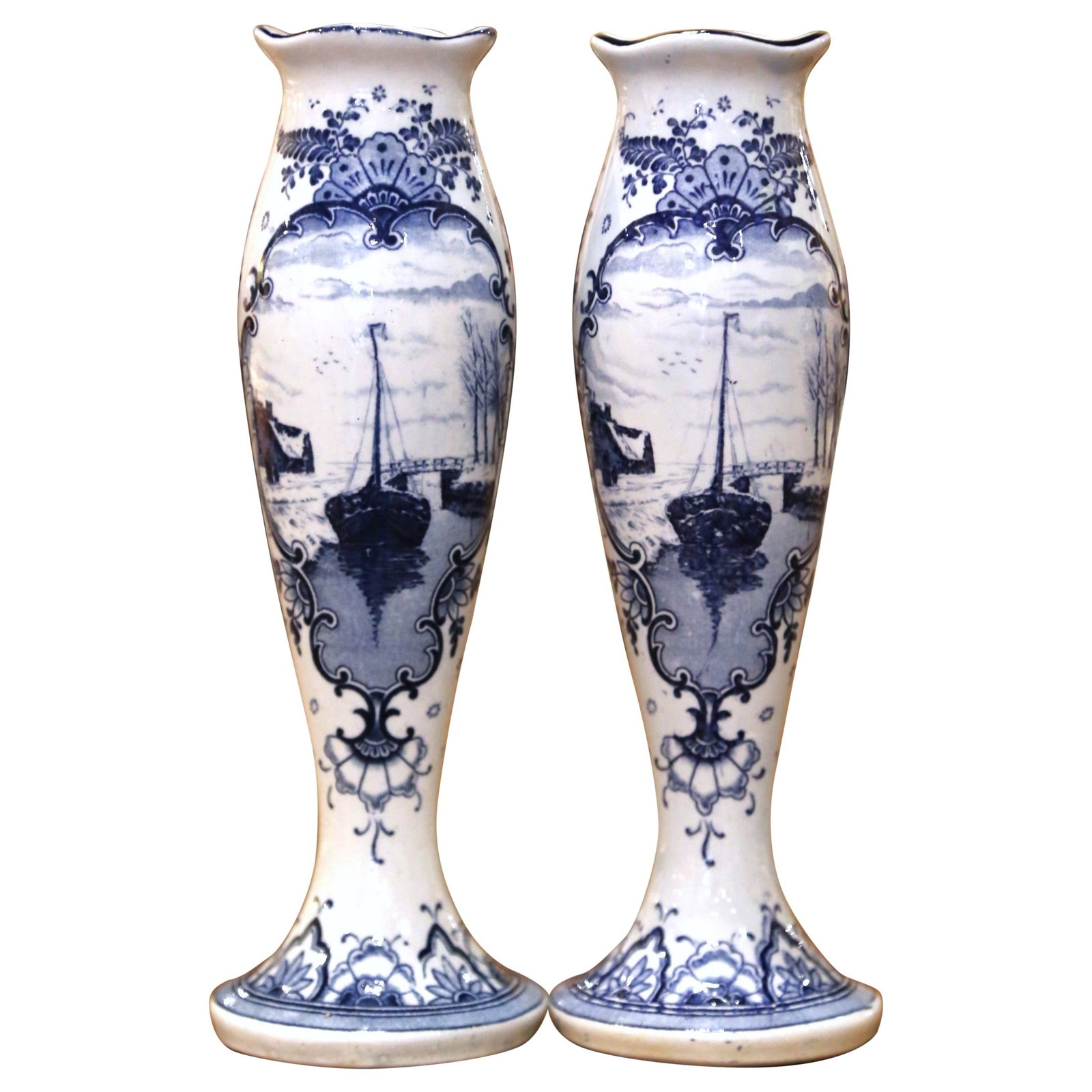 Set of 2 Delft Faience Bud Vases Dutch Blue White: Set of 2 Delft Faience Bud Vases Dutch Blue White This pair of early 20th-century Dutch Delft bud vases features a classic trumpet form with flared foot, tapered body, and gently scalloped rim. Handcr