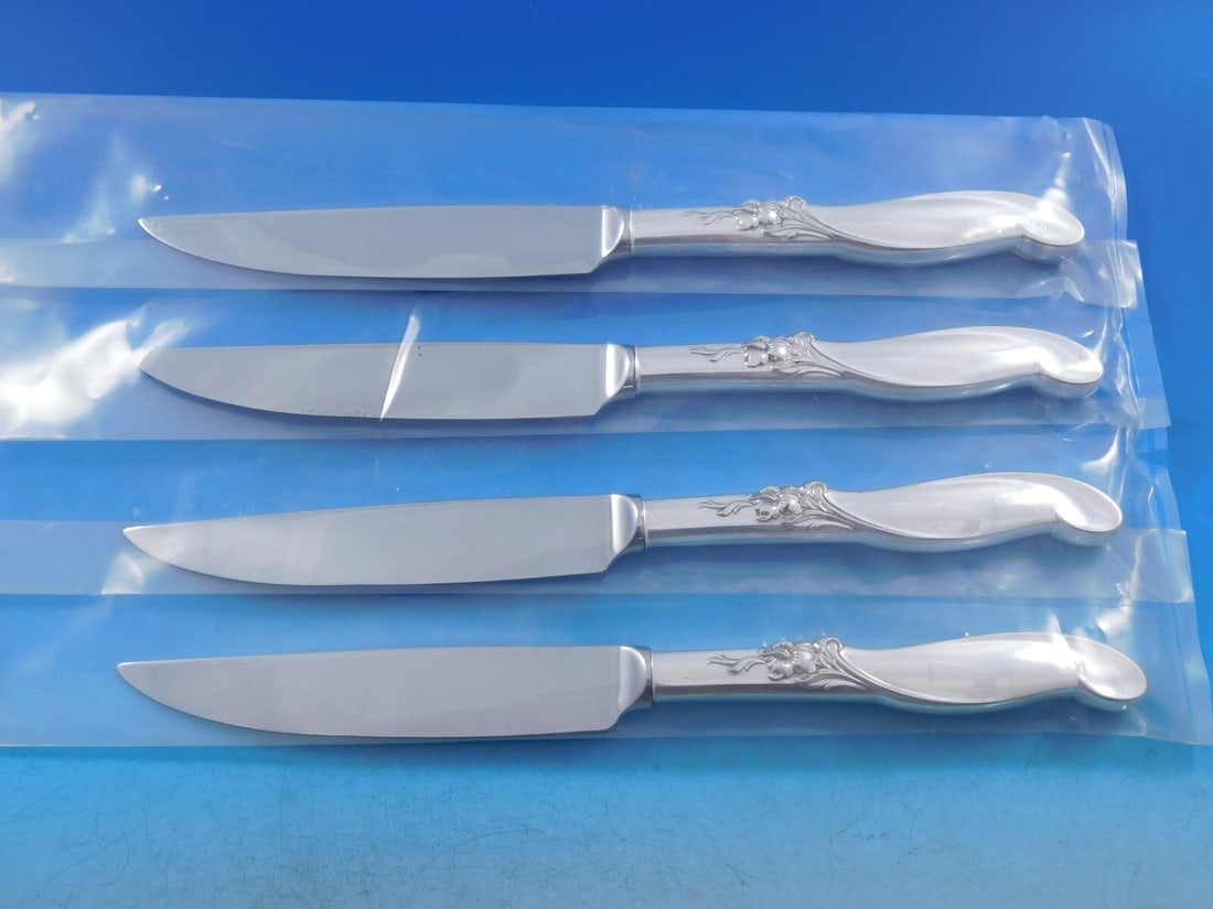 International Silver Silver Melody 4pc Sterling Silver Steak Knife Set: International Silver Silver Melody 4pc Sterling Silver Steak Knife Set Elevate your dining experience with this exquisite 4-piece Sterling Silver Steak Knife Set from International Silver, featuring t