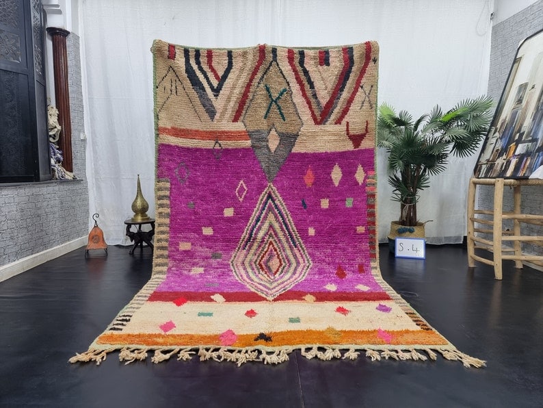 Handmade Moroccan Berber Wool Rug 8 x 5 Feet in Pink: Handmade Moroccan Berber Wool Rug 8 x 5 Feet in Pink Discover the elegance of this Stylish Pink Rug, a stunning handmade Moroccan Berber creation. Crafted by skilled local women weavers in the Atlas M