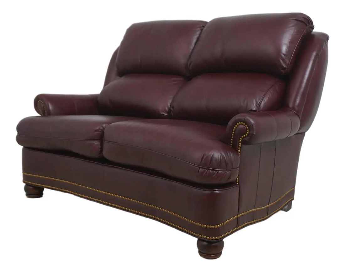 Burgundy Leather Loveseat with Ball and Claw Feet by Hancock and Moore: Burgundy Leather Loveseat with Ball and Claw Feet by Hancock and Moore This Hancock & Moore loveseat features burgundy leather upholstery and traditional ball and claw feet. Crafted with high-quality 