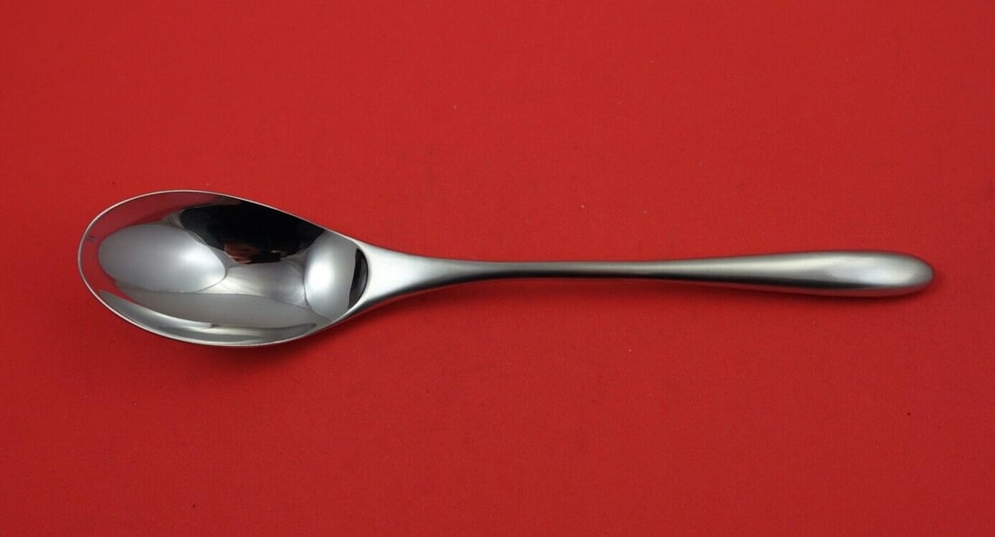 Taille Serving Spoon by Rosenthal Stainless Steel 8 3/4": Taille Serving Spoon by Rosenthal Stainless Steel 8 3/4" Enhance your dining experience with this exquisite Taille Serving Spoon by Rosenthal. Crafted from high-quality stainless steel, this spoon fea