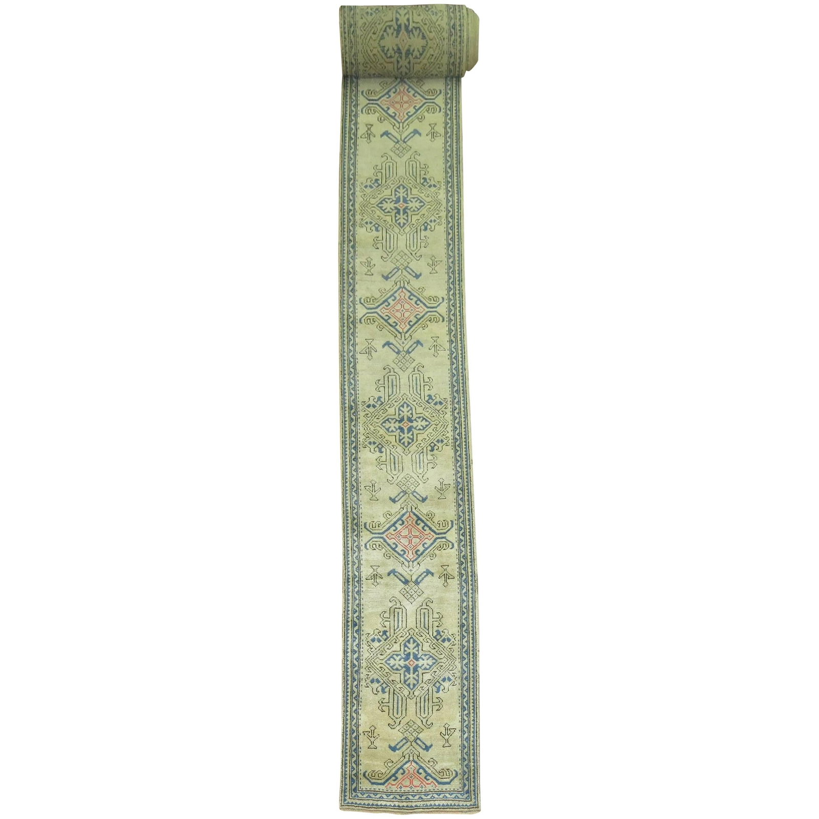 28 x 416 in Turkish Wool Hand Knotted Oushak Runner: 28 x 416 in Turkish Wool Hand Knotted Oushak Runner This antique Oushak hallway or staircase runner features a long, narrow design with a beautiful combination of blue and pink tones on a bone-colored