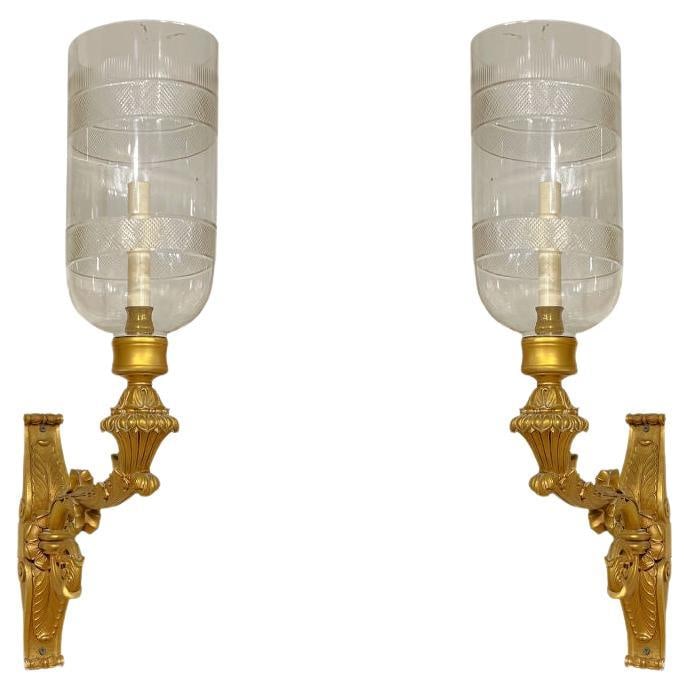 Set of 4 French Empire Gilt Bronze Wall Lights with Hurricane Glass Shades: Set of 4 French Empire Gilt Bronze Wall Lights with Hurricane Glass Shades This set includes four large, antique neoclassical sconces crafted from gilt bronze and featuring blown glass hurricane-style