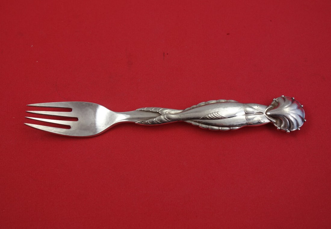 Georg Jensen Ornamental No. 55 Sterling Silver Fish Fork 7.5" GI: Georg Jensen Ornamental No. 55 Sterling Silver Fish Fork 7.5" GI Discover the elegance of this Ornamental No. 55 fish fork by Georg Jensen, crafted from high-quality sterling silver. This exquisite pi