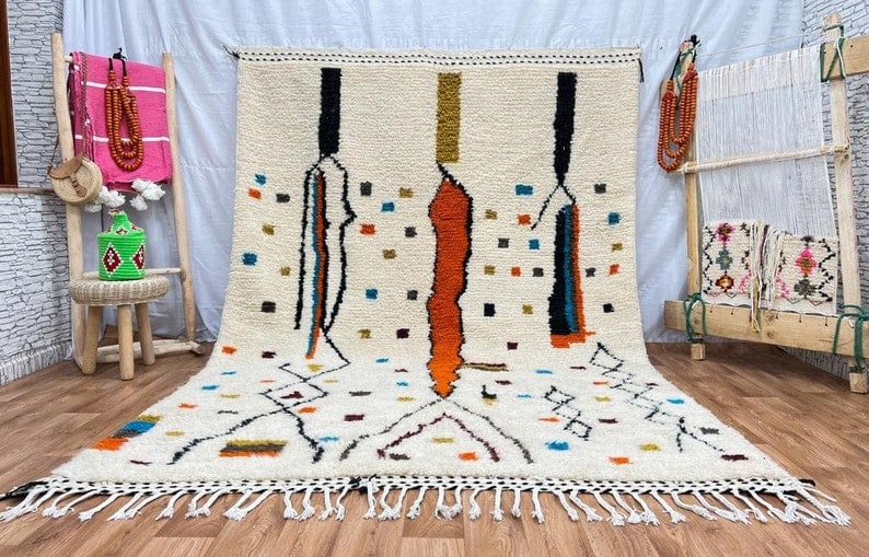 Authentic Handwoven Artistic Rug from Morocco 100% Sheep Wool: Authentic Handwoven Artistic Rug from Morocco 100% Sheep Wool This authentic Artistic Rug is a stunning handwoven piece crafted by skilled Berber women weavers in the Atlas Mountains of Morocco. Made 