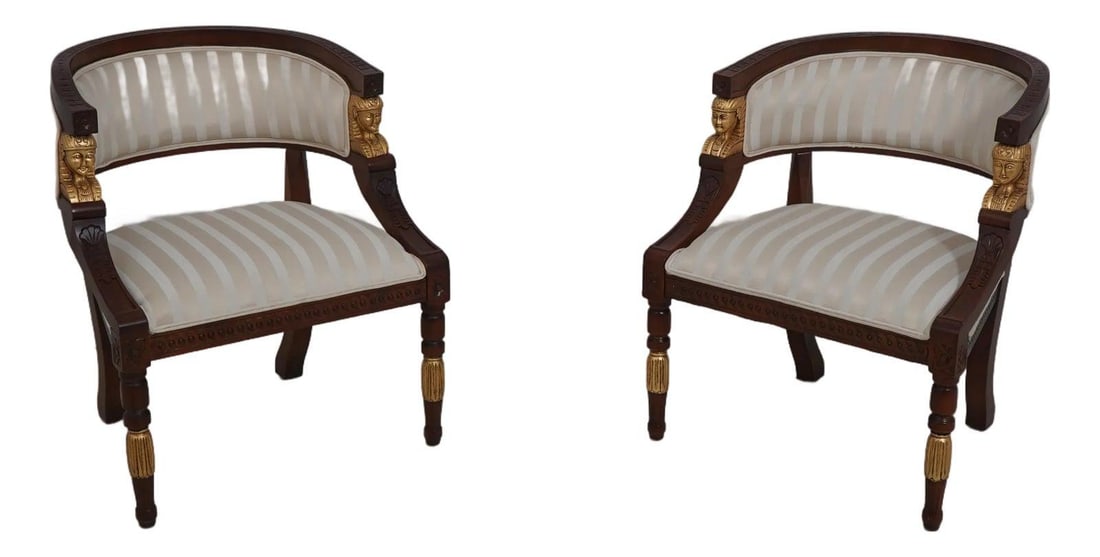 Exquisite Pair of Egyptian Revival Curved Back Tub Chairs: Exquisite Pair of Egyptian Revival Curved Back Tub Chairs This pair of Egyptian Revival curved back tub chairs showcases exquisite craftsmanship with their nicely carved details and elegant design. Th