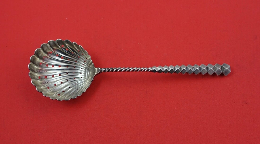 Dominick and Haff Diamond Twist Sterling Silver Sugar Sifter 7": Dominick and Haff Diamond Twist Sterling Silver Sugar Sifter 7" This exquisite sugar sifter is crafted from sterling silver and features the elegant Diamond Twist pattern by Dominick and Haff. Measuri