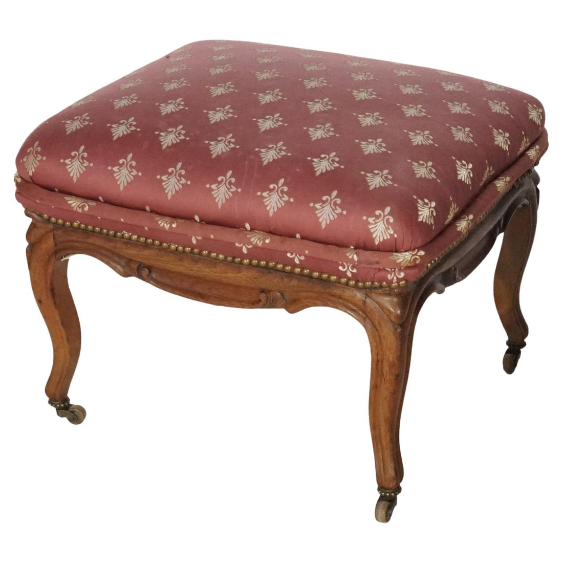 Vintage French Carved Walnut Footstool C1920 Upholstered in Red Fabric: Vintage French Carved Walnut Footstool C1920 Upholstered in Red Fabric This exquisite antique French style footstool, dating from circa 1920, features a beautifully upholstered seat resting on a carve